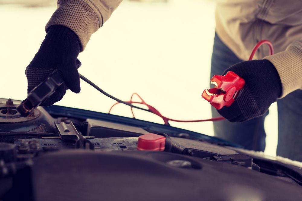 Man Holding Starter Cables