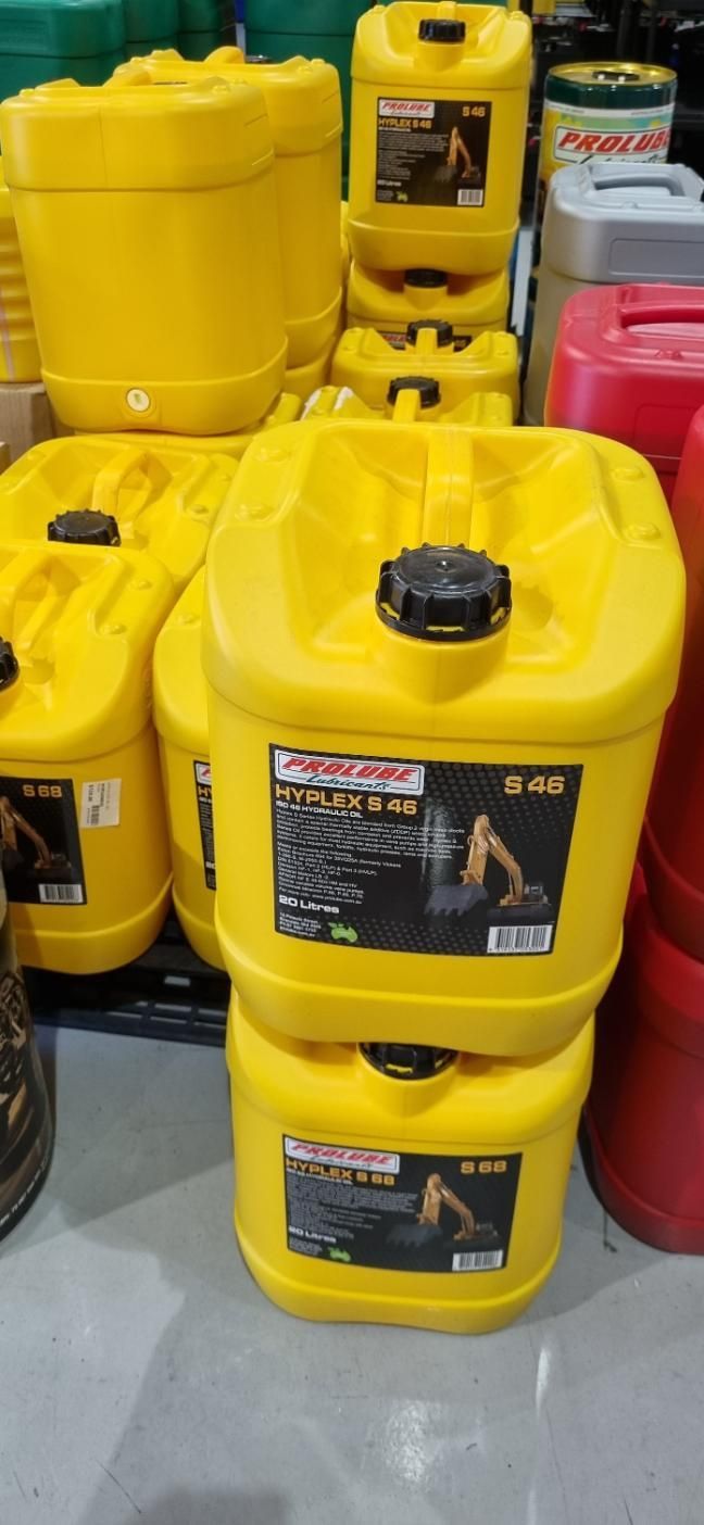 A Bunch Of Yellow Barrels Stacked On Top Of Each Other In A Warehouse — Auto Spares Morisset In Morisset, NSW