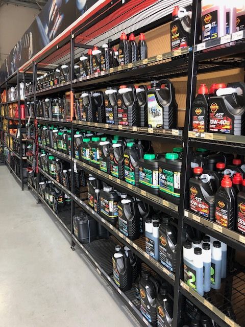 A Row Of Shelves Filled With Lots Of Bottles Of Oil — Auto Spares Morisset In Morisset, NSW