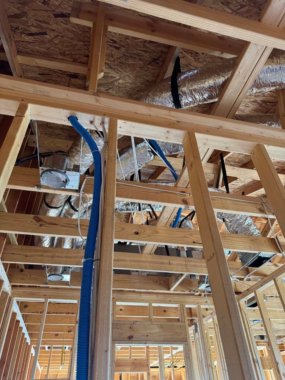 Looking up at the ceiling of a house under construction.