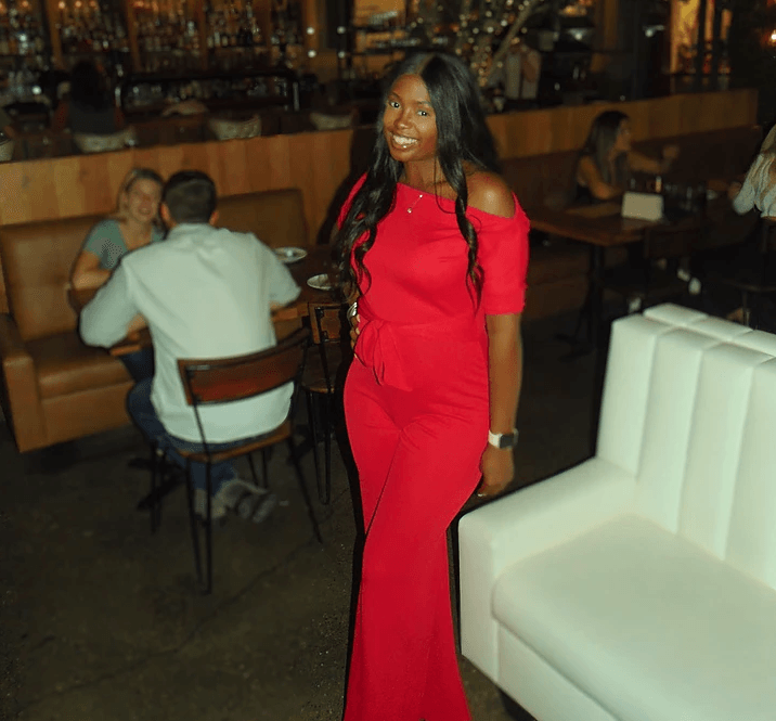 Dymond in red jumpsuit