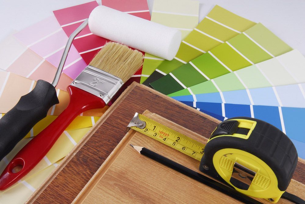 A Tape Measure Is Lying On A Piece Of Wood With Color Pallete — A Brush With Colour in Maryborough, QLD