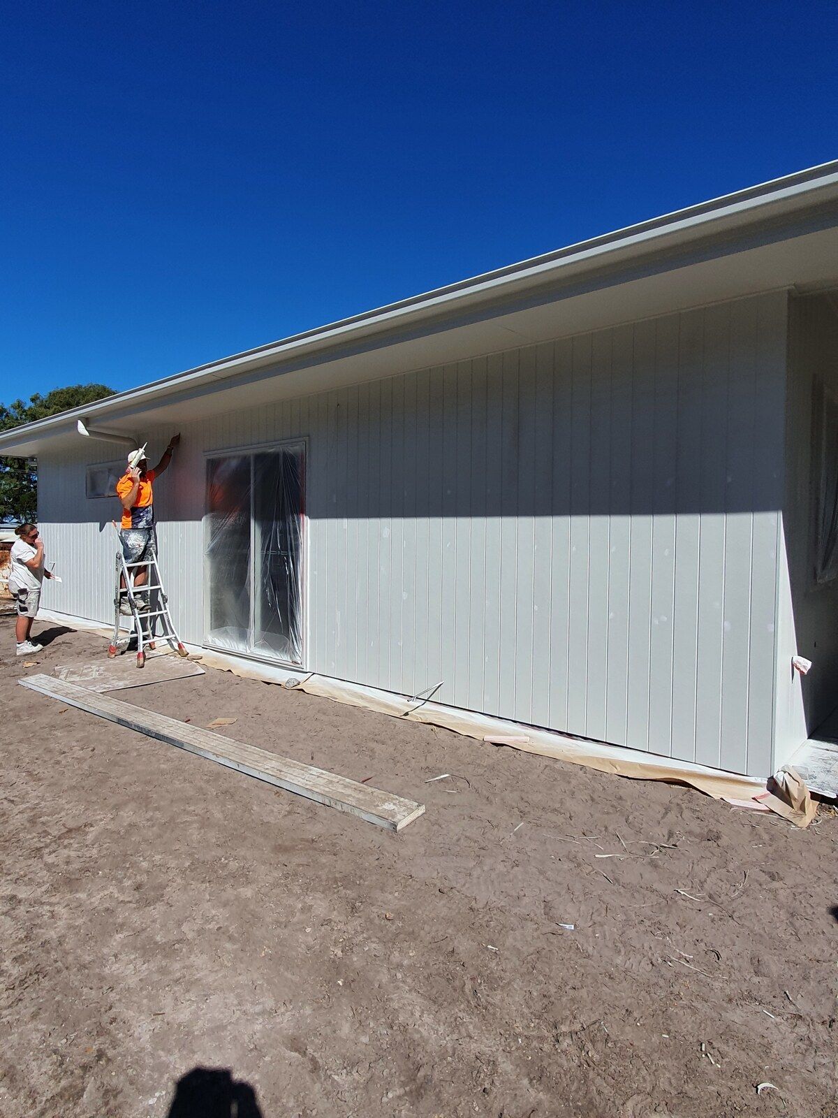A Person Is Spraying Powder Paint on A Piece of Metal — A Brush With Colour in Burrum Heads, QLD