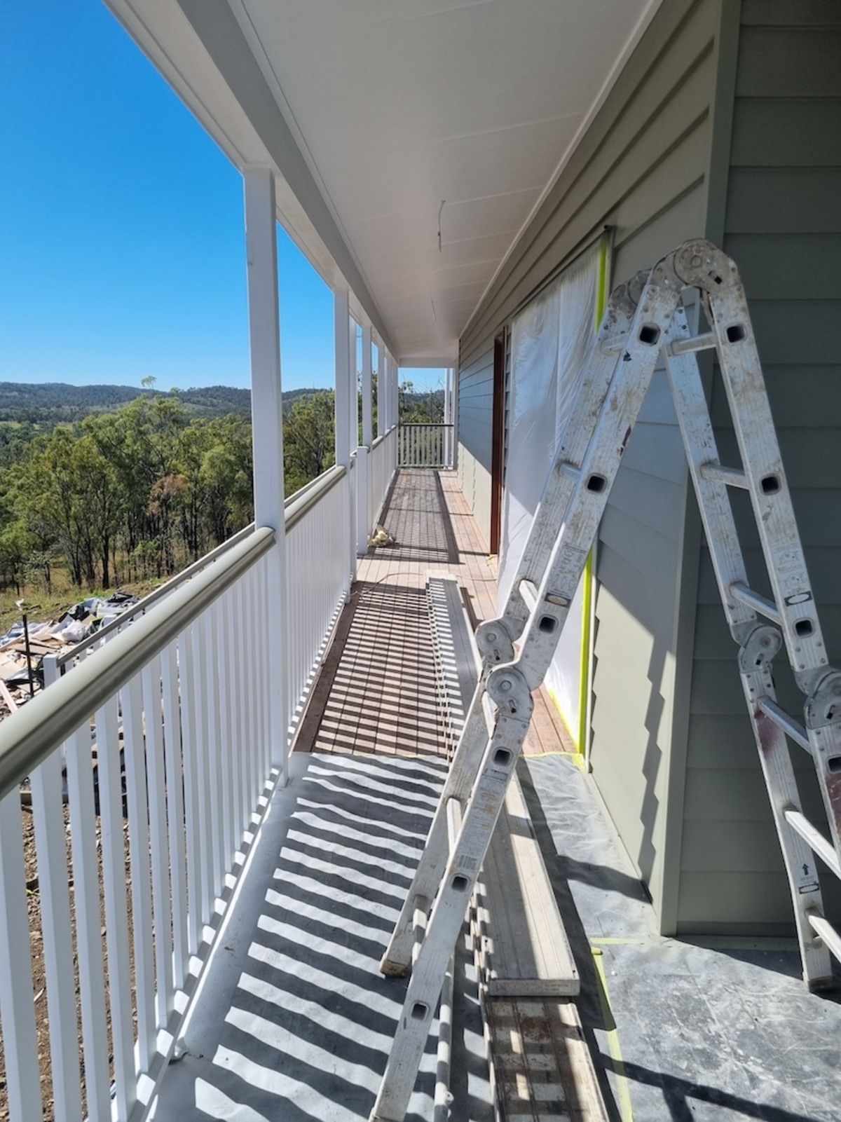 A Person Is Spraying Powder Paint on A Piece of Metal — A Brush With Colour in Urangan, QLD