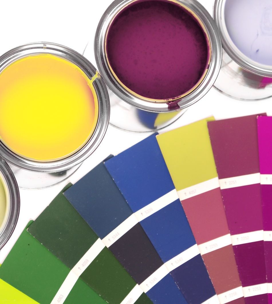 Several Cans of Paint Sit Next to A Palette of Colors — A Brush With Colour in Torquay, QLD
