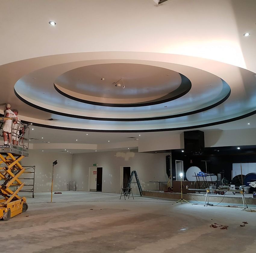 A Large Room with A Circular Ceiling Is Being Remodeled — A Brush With Colour in Torquay, QLD
