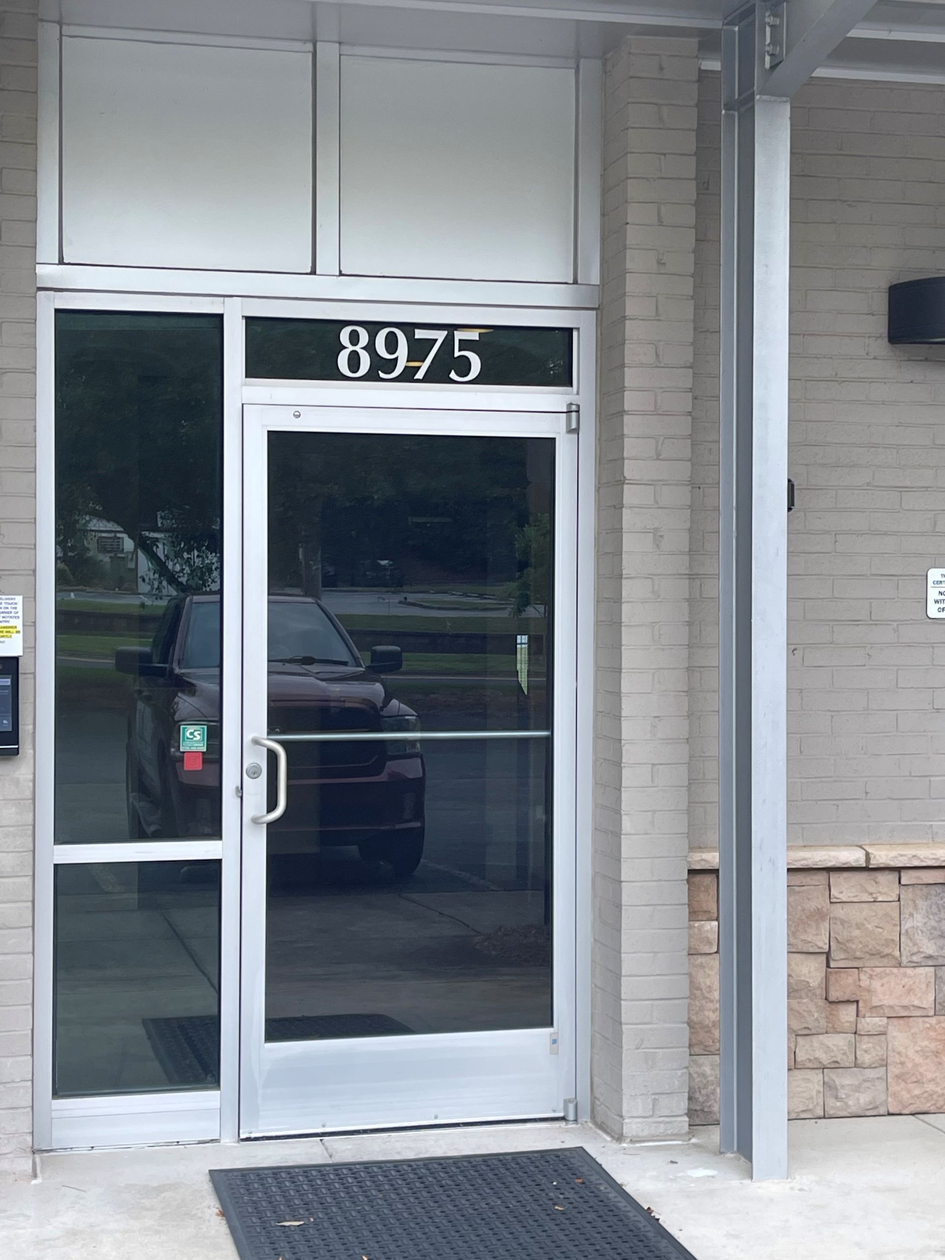 Door With The Number 8975 Before - Lithia Springs, GA - Tint Life Window Tinting Wraps & PPF