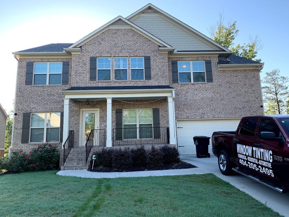 a brick house with a window tinting truck parked in front of it - Lithia Springs, GA - TLWT LLC