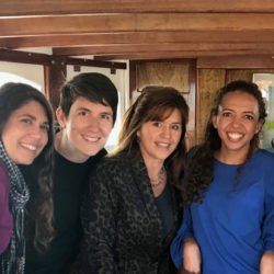 A group of people are posing for a picture on a boat.