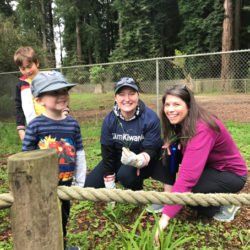 A group of people are working in a garden.