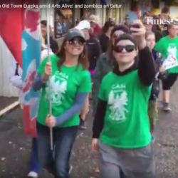 A group of people wearing green shirts with the word cash on them