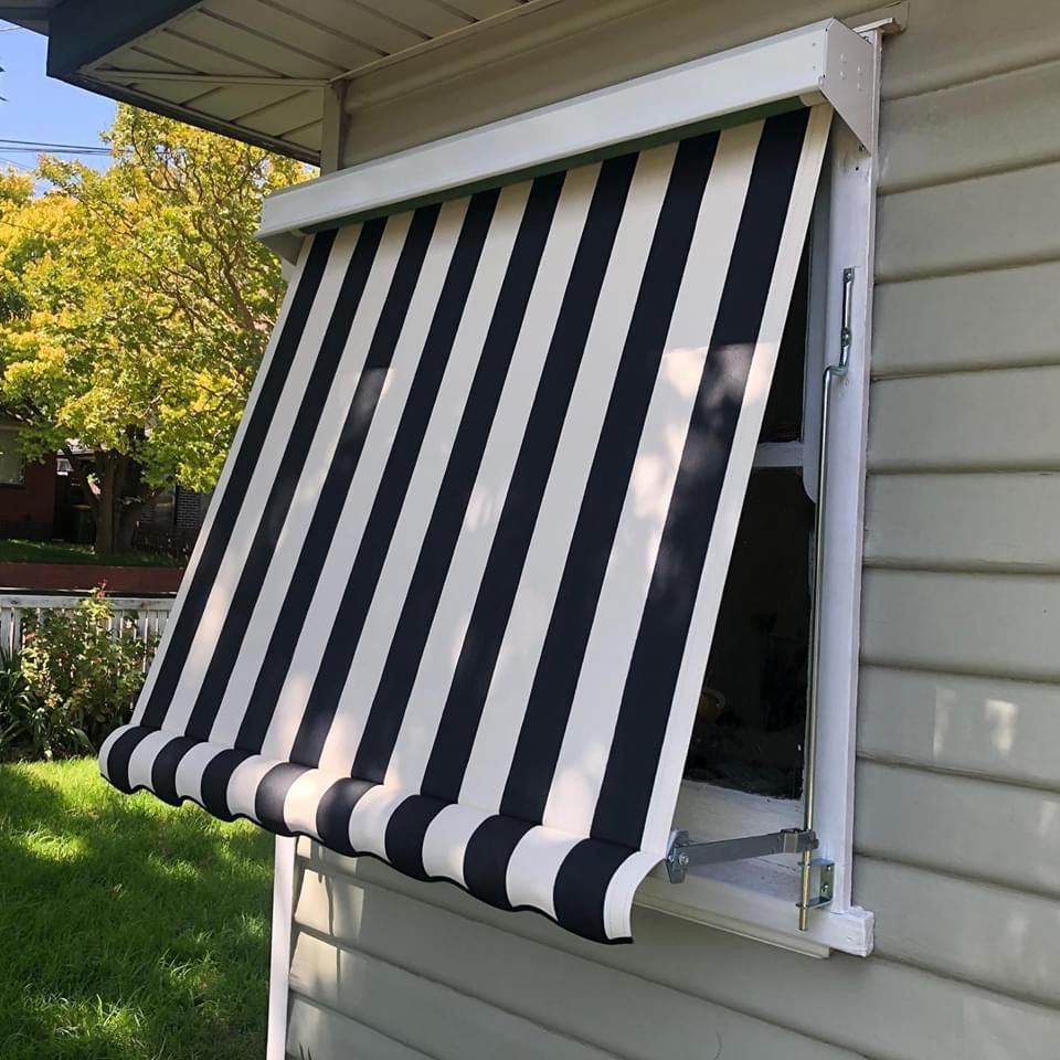 A Large Striped Awning is Hanging — Homestead Blinds in Wodonga, VIC