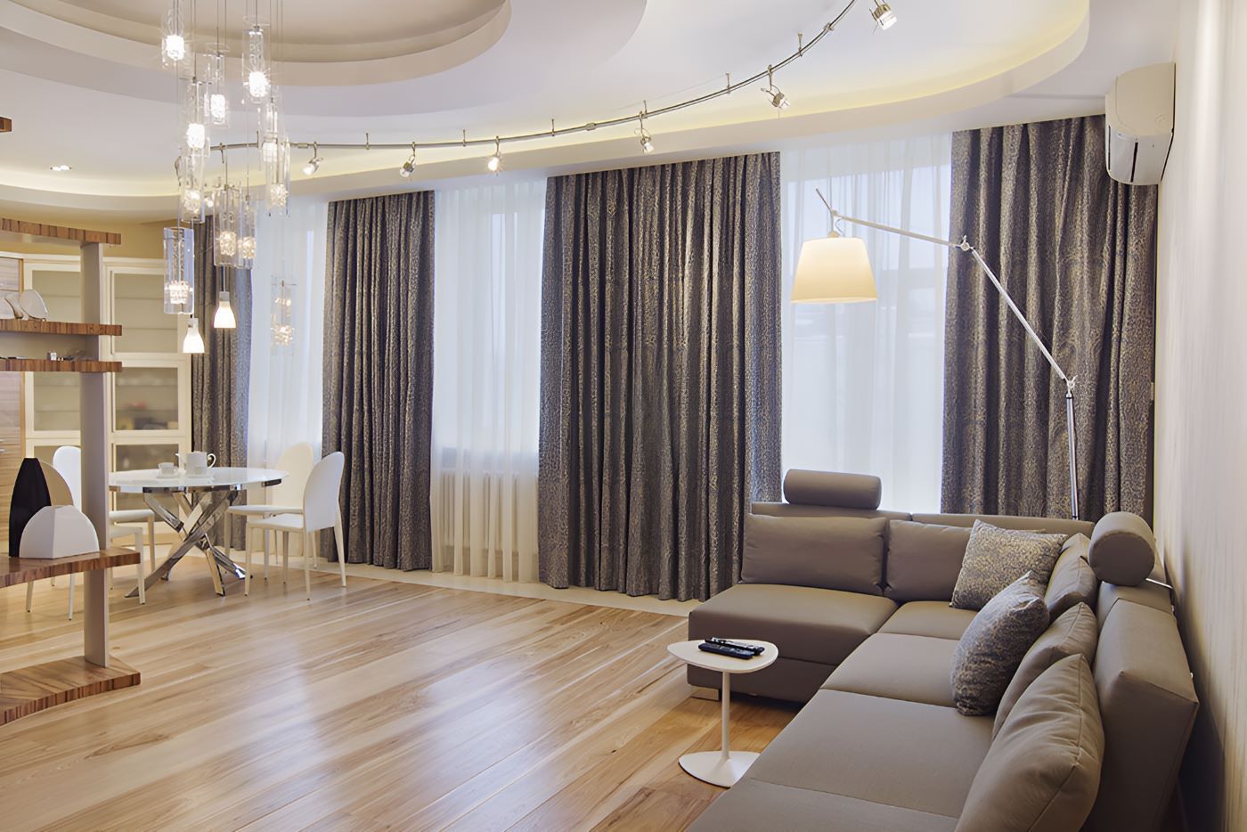 A Living Room With a Couch, Table, Chairs and Curtains — Homestead Blinds in Wodonga, VIC