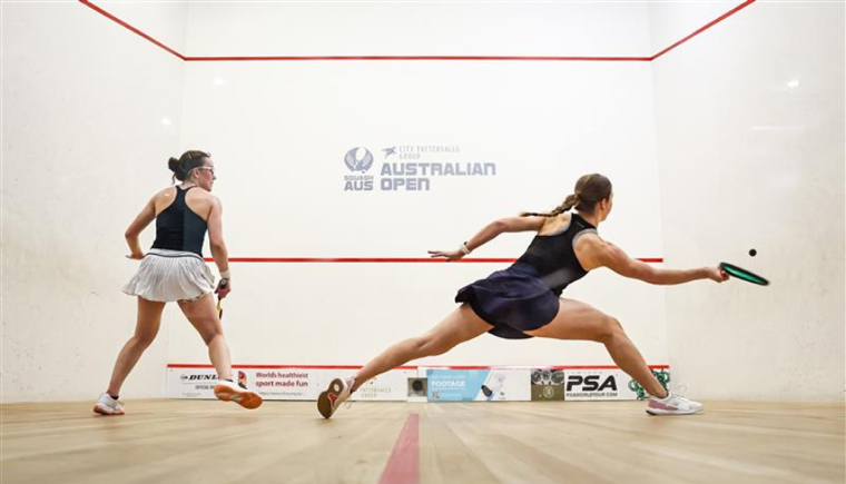 Alex Haydon on court playing a game of squash.