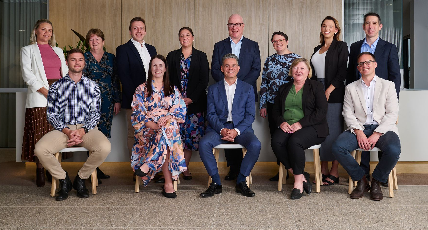 Photo of all the Partners & Principals at Brentnalls SA standing in the foyer at 255 Port Road, Hindmarsh 5007.