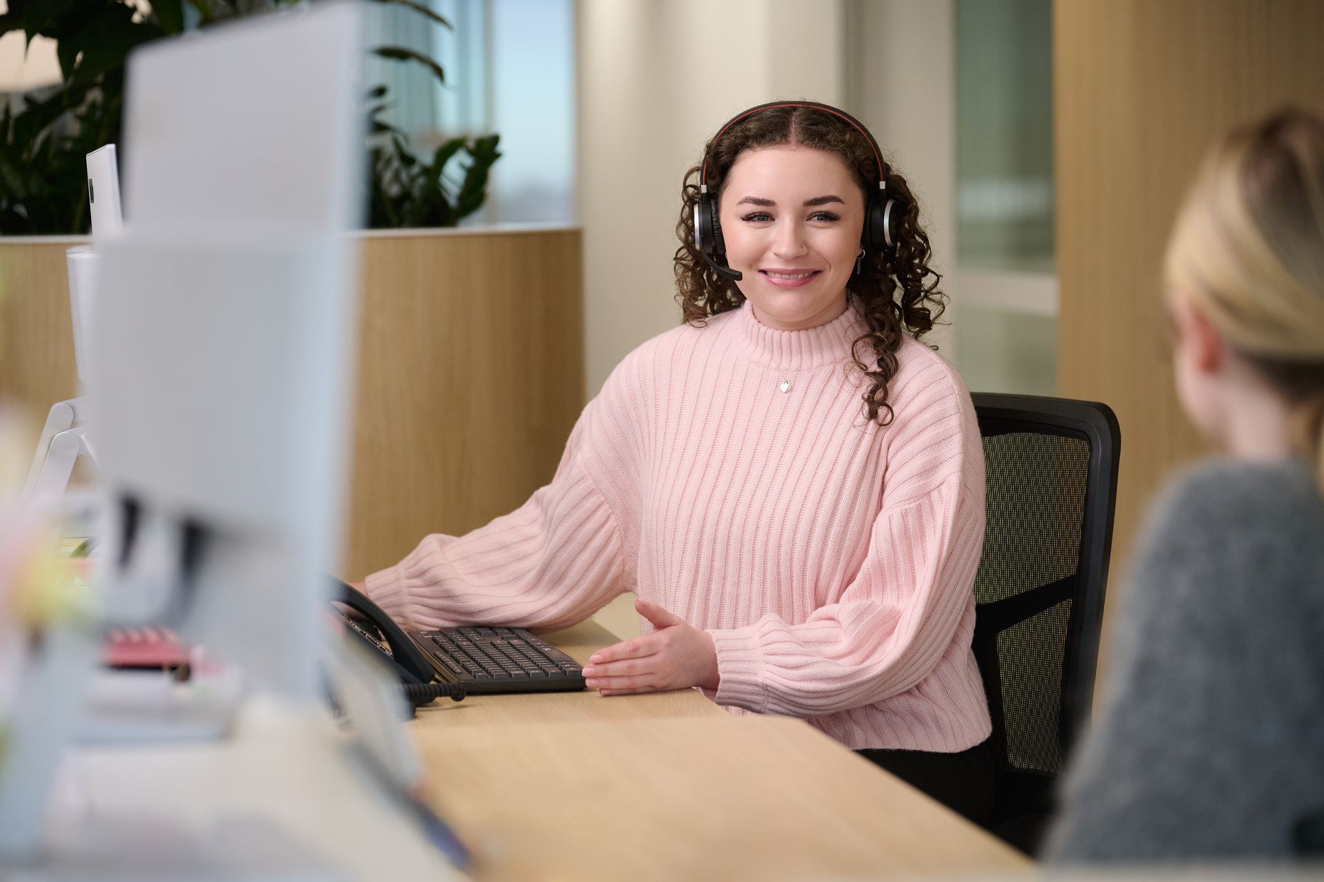 Shali Manolev, Partner and Danny Haydon, Principal talking with a Healthcare receptionists.