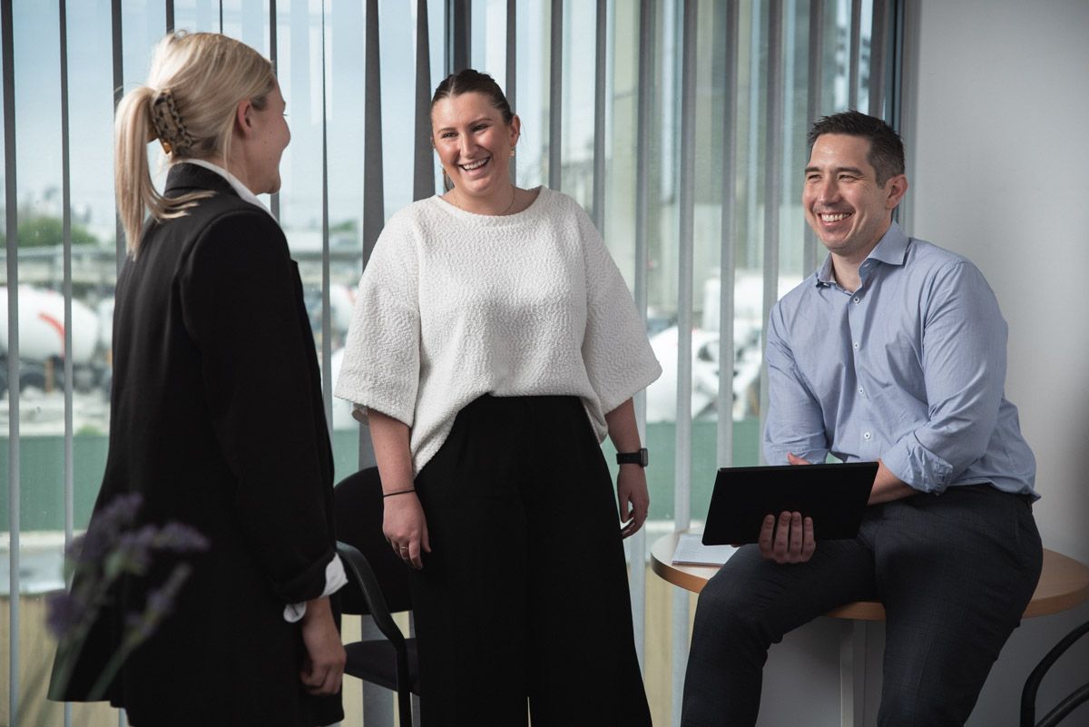 A manager communicating changes to his team and encouraging feedback.