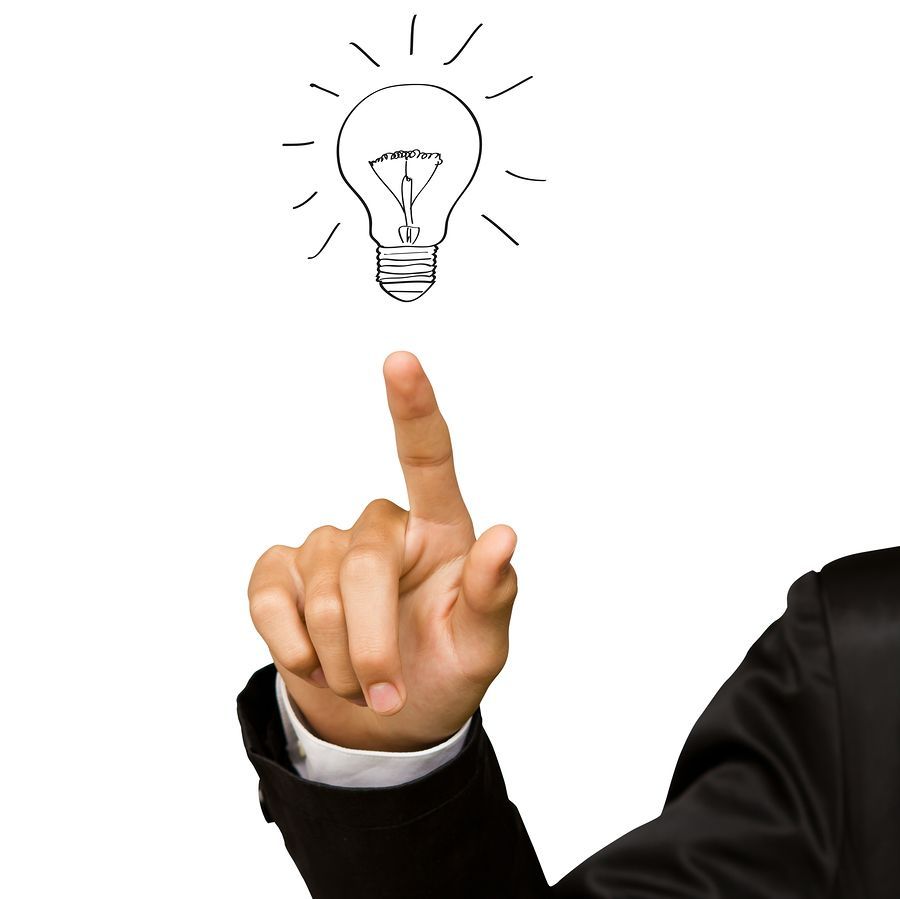 Business man hand drawing light bulb  isolated on white