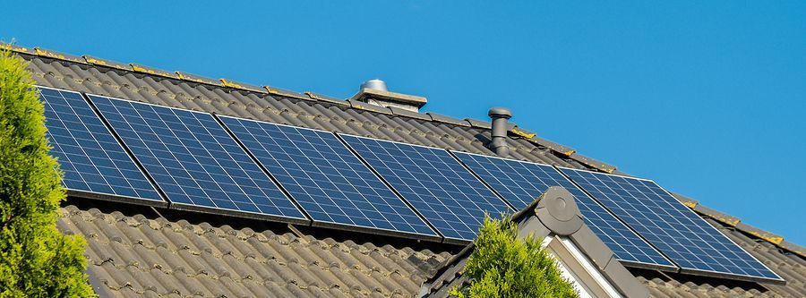 A house roof with solar panels on it.