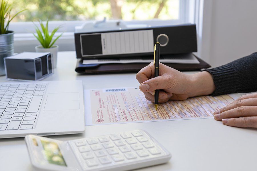 View Of Woman Completing Australian Tax Form.