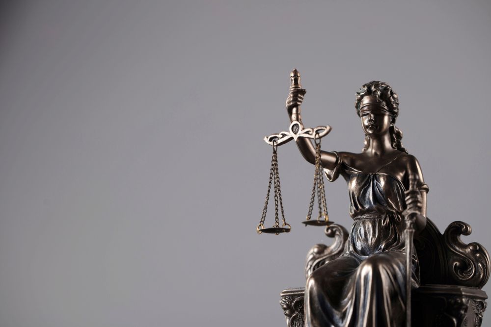 Statue of Lady Justice Holding Scales — Hannaway Lawyers in Port Laurieton, NSW