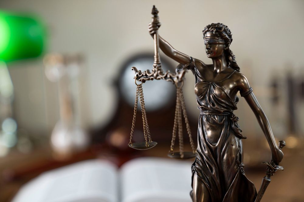 Statue of Lady Justice Holding Scales and Sword — Hannaway Lawyers in Port Macquarie, NSW