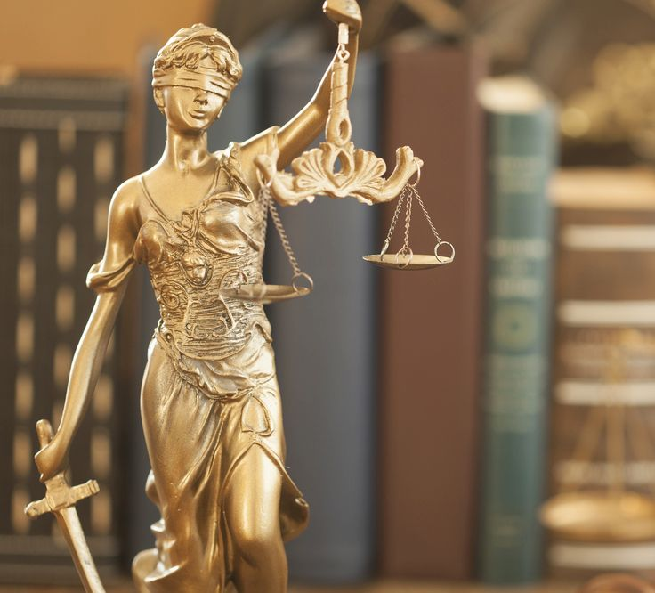 Golden Statue of Lady Justice With Scales and Sword, Blindfolded — Hannaway Lawyers in Taree, NSW