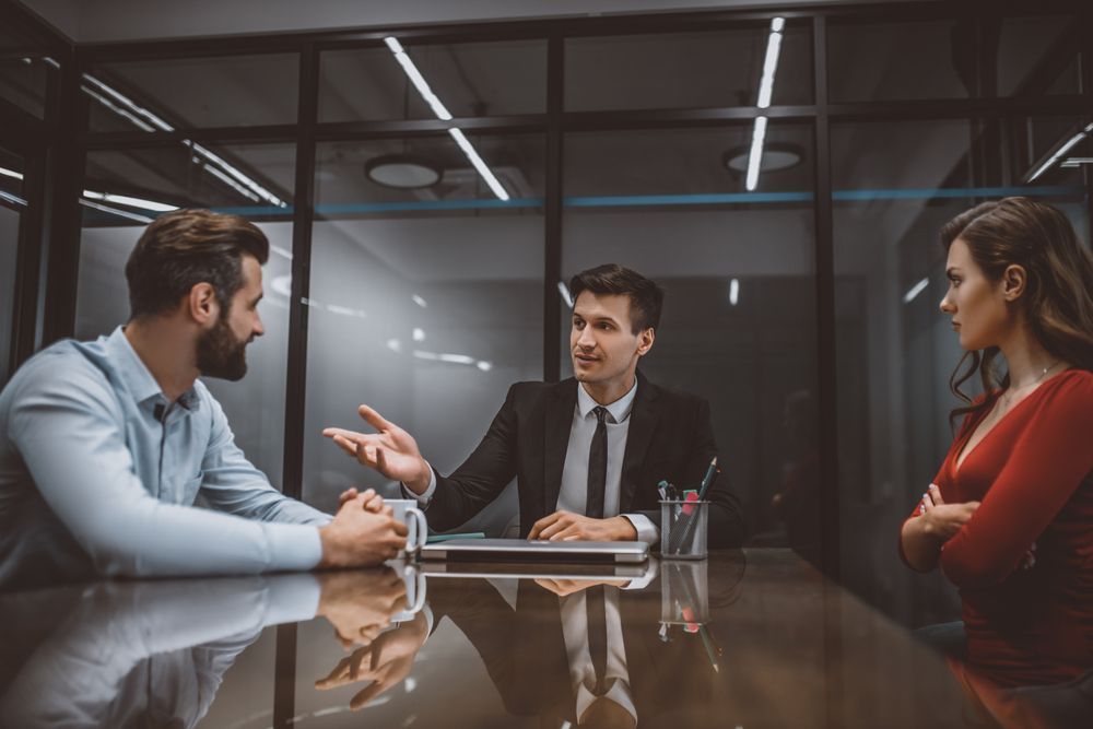 A Man in a Suit Mediates Between a Couple — Hannaway Lawyers in Port Macquarie, NSW