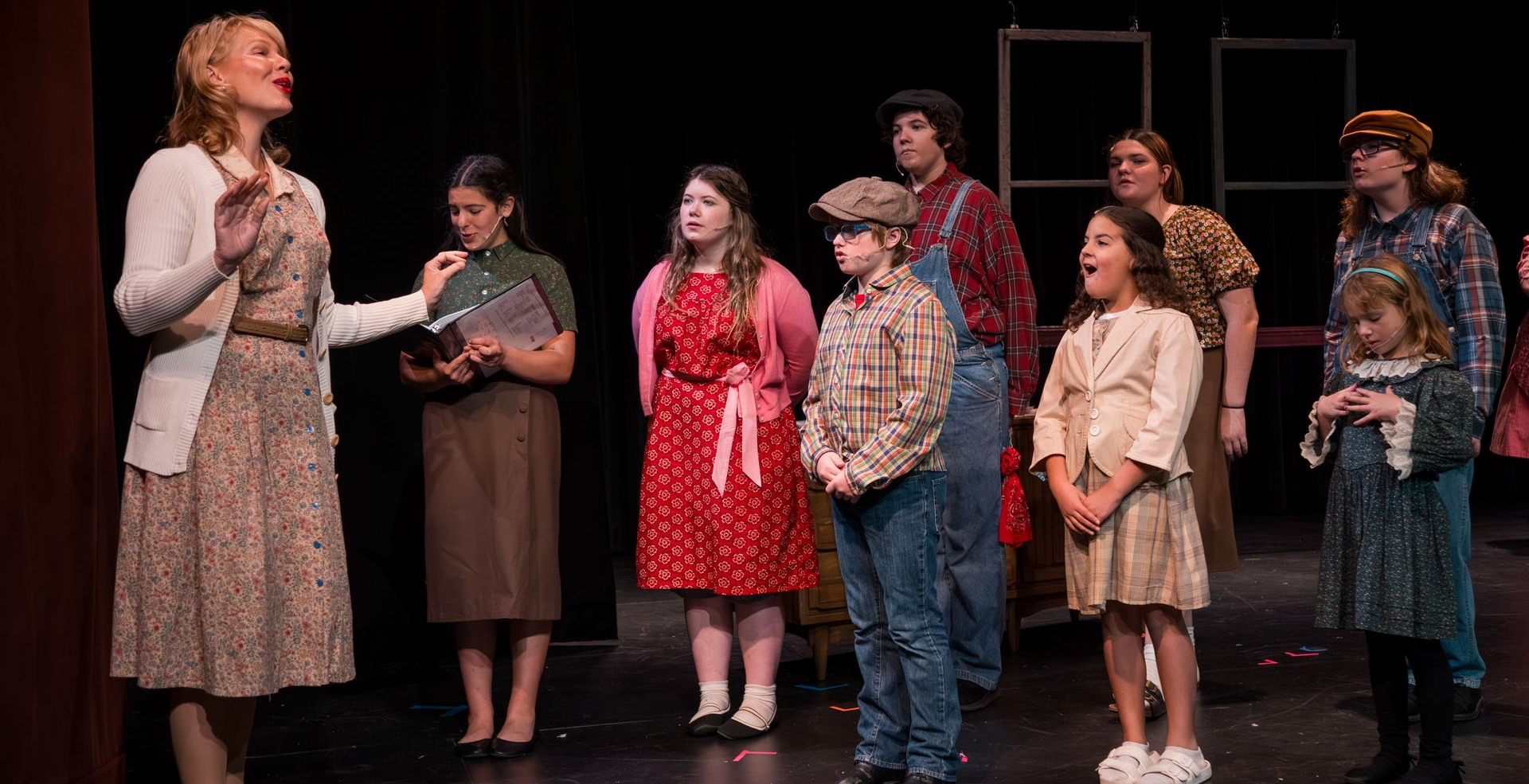 Logo for Greater Cleburne Carnegie Players: theater masks within a building outline, text below.