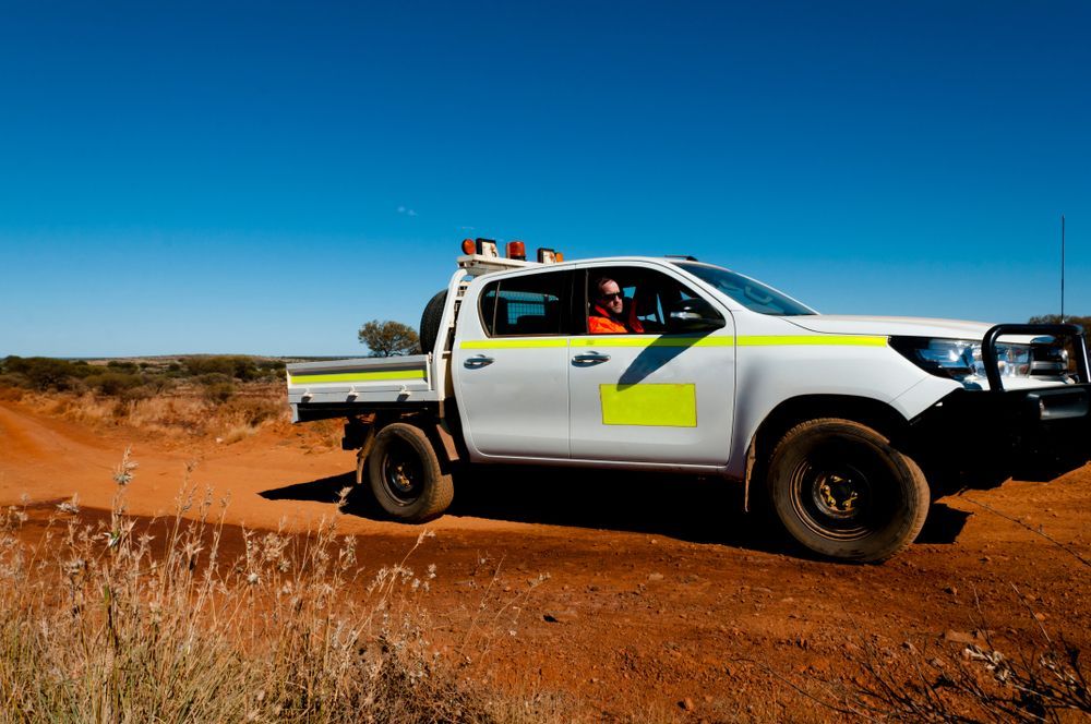 White Pickup Truck on a Dirt Road — Morty's Mechanical In Garbutt, QLD