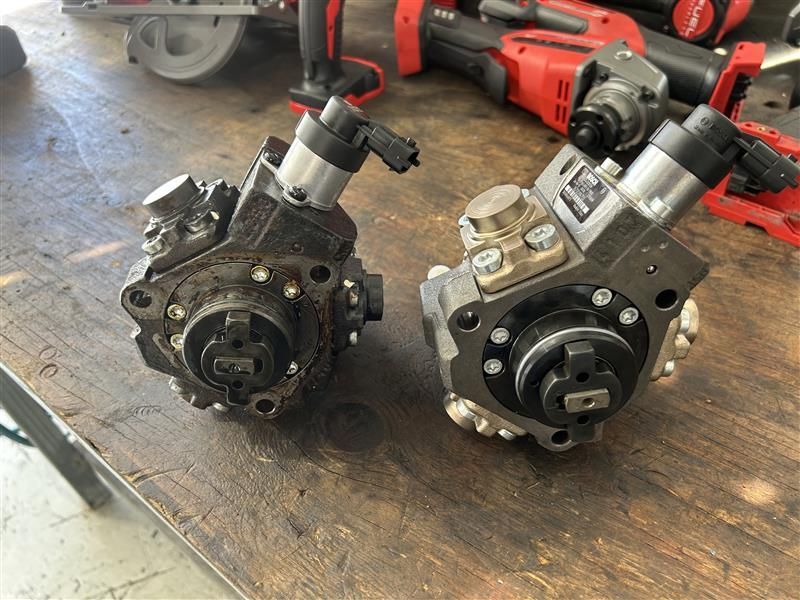 Two Fuel Pumps Side-by-side on a Workbench — Morty's Mechanical In Garbutt, QLD