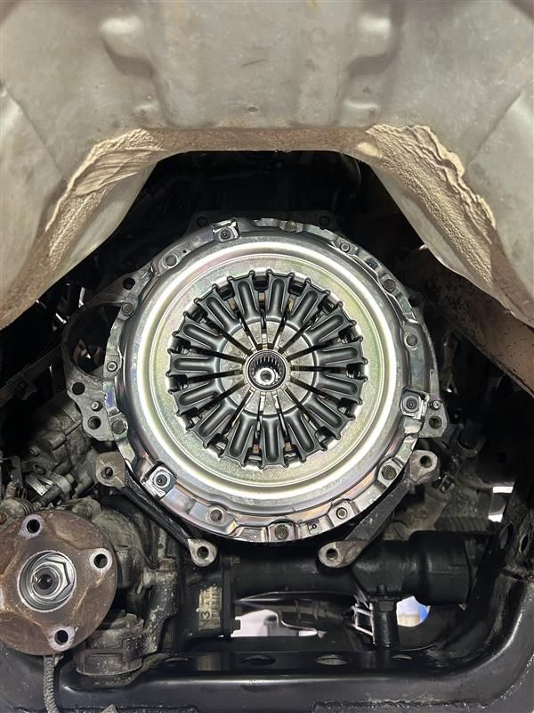 A View From Underneath a Vehicle Showing a New Clutch Assembly — Morty's Mechanical In Garbutt, QLD