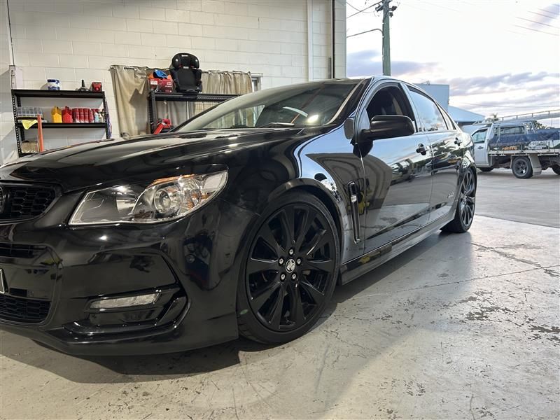 Black Holden Sedan Parked Inside a Garage — Morty's Mechanical In Garbutt, QLD