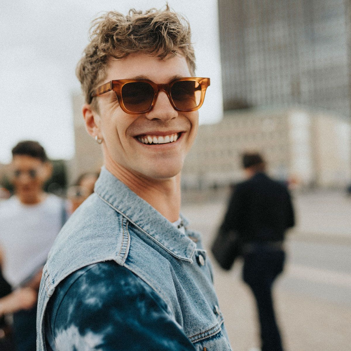 Portrait of smiling young man in sunglasses at street Portrait of smiling young man in sunglasses at street
