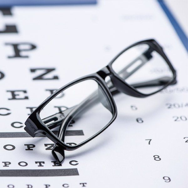 Prescription Eyeglasses & Sunglasses — Eyeglasses with Eye Chart in Charlotte, NC