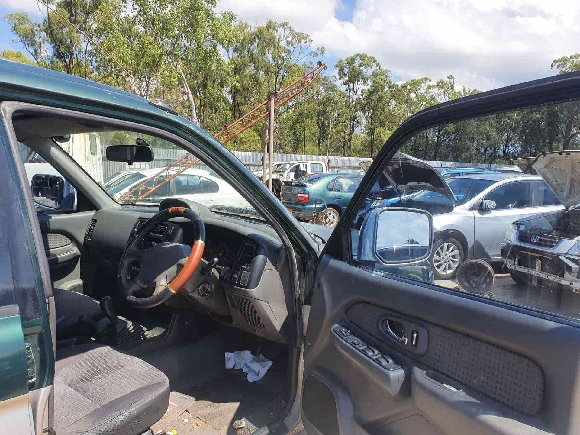 Drivers Car Door Open — Local Vehicle Scrapping And Repair Professionals in Bondoola, QLD