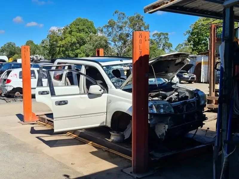 Wrecked Car Outside Workshop — Local Vehicle Scrapping And Repair Professionals in Bondoola, QLD