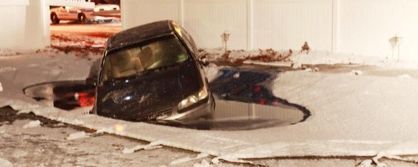 A car is stuck in a pool.