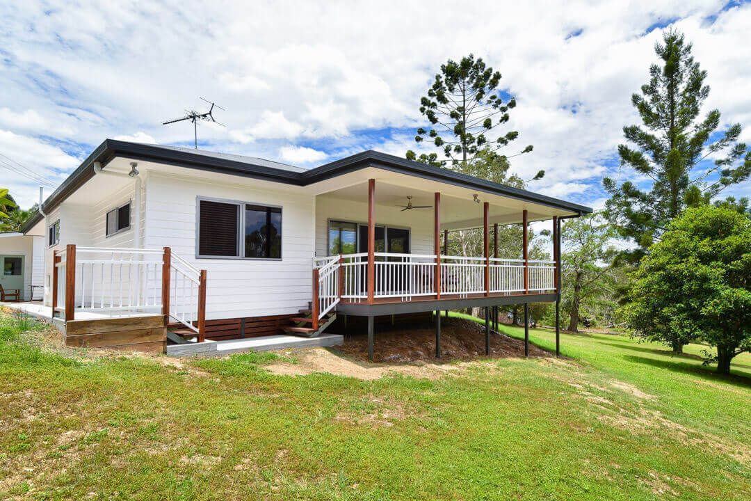 It is a large room with a lot of windows and stairs.