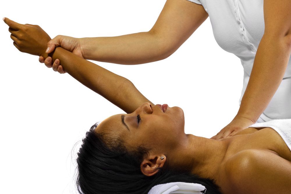 A woman is getting a massage from another woman