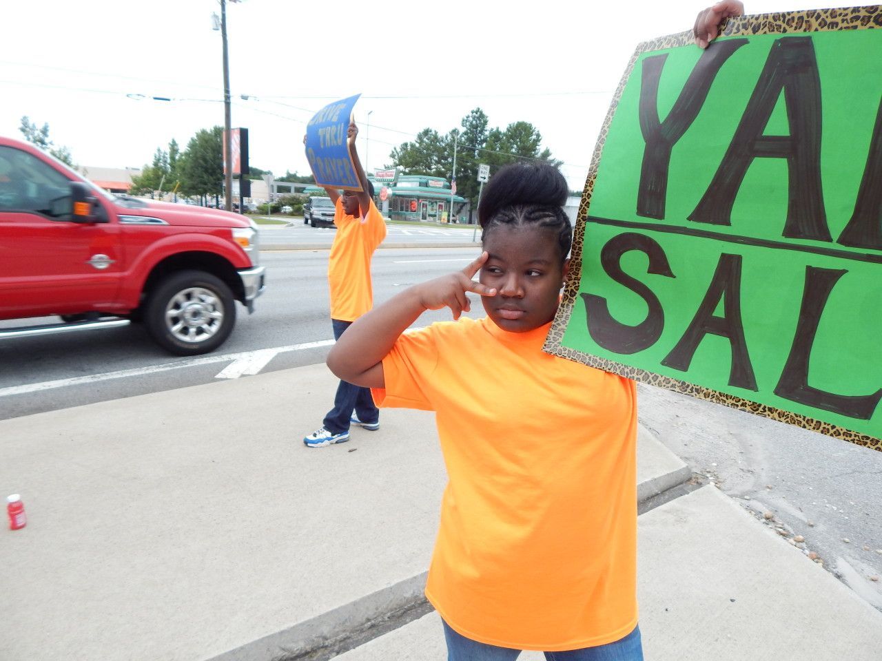 A girl doing a peace sign - Snellville, GA - Abiding Community Church