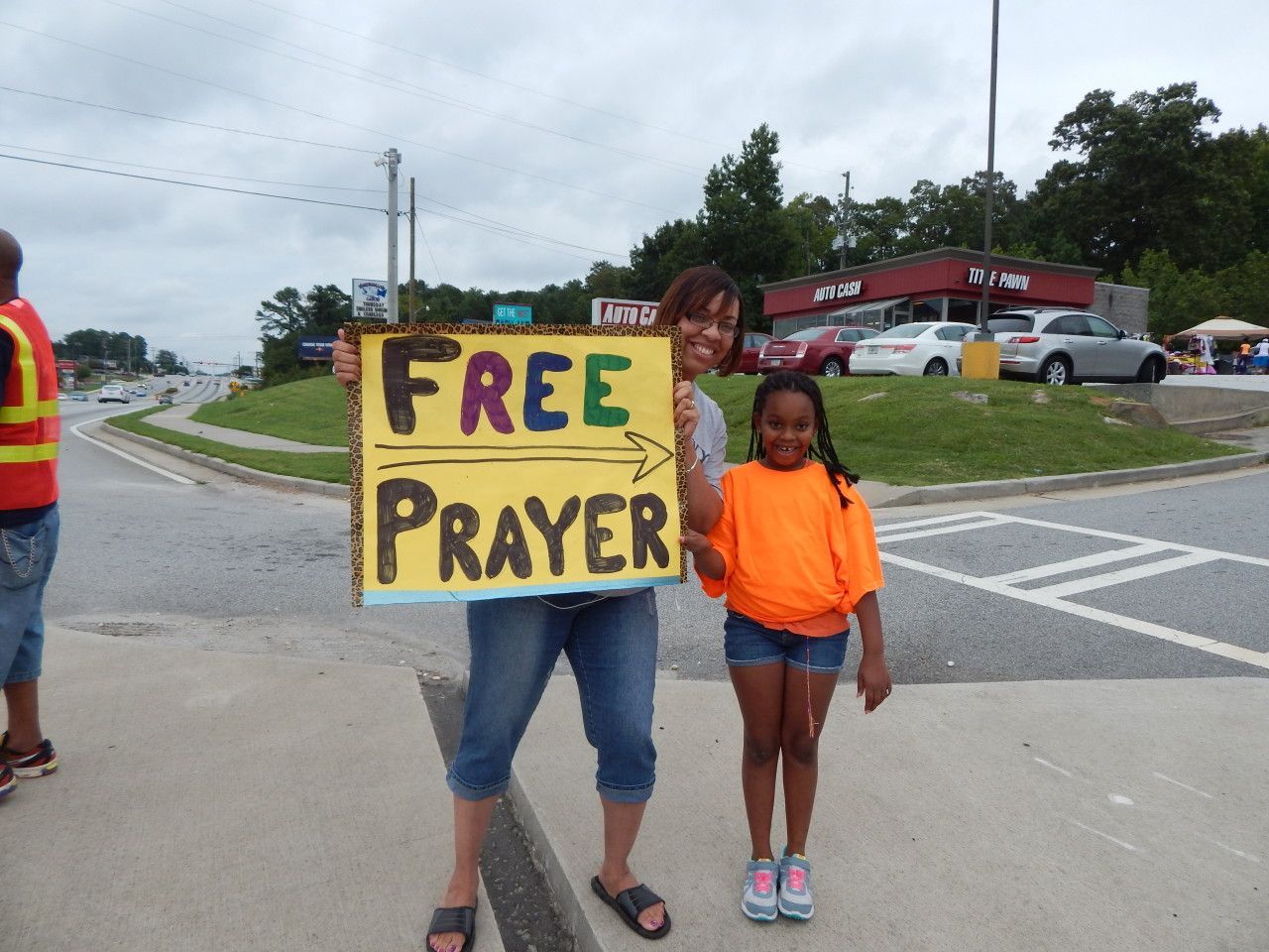 Two girls holding a free prayer banner - Snellville, GA - Abiding Community Church