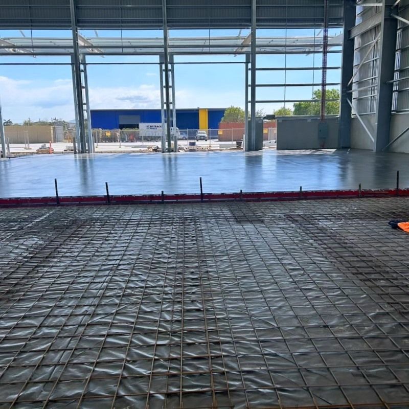 A Large Building Under Construction With A Concrete Floor — Core Concrete in Cairns, QLD