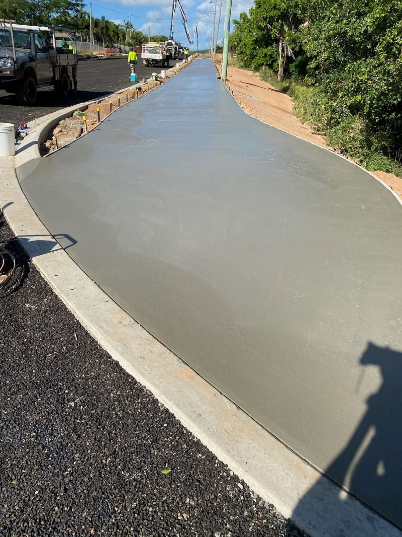 A Concrete Walkway Is Being Built On The Side Of A Road — Core Concrete in Cairns, QLD