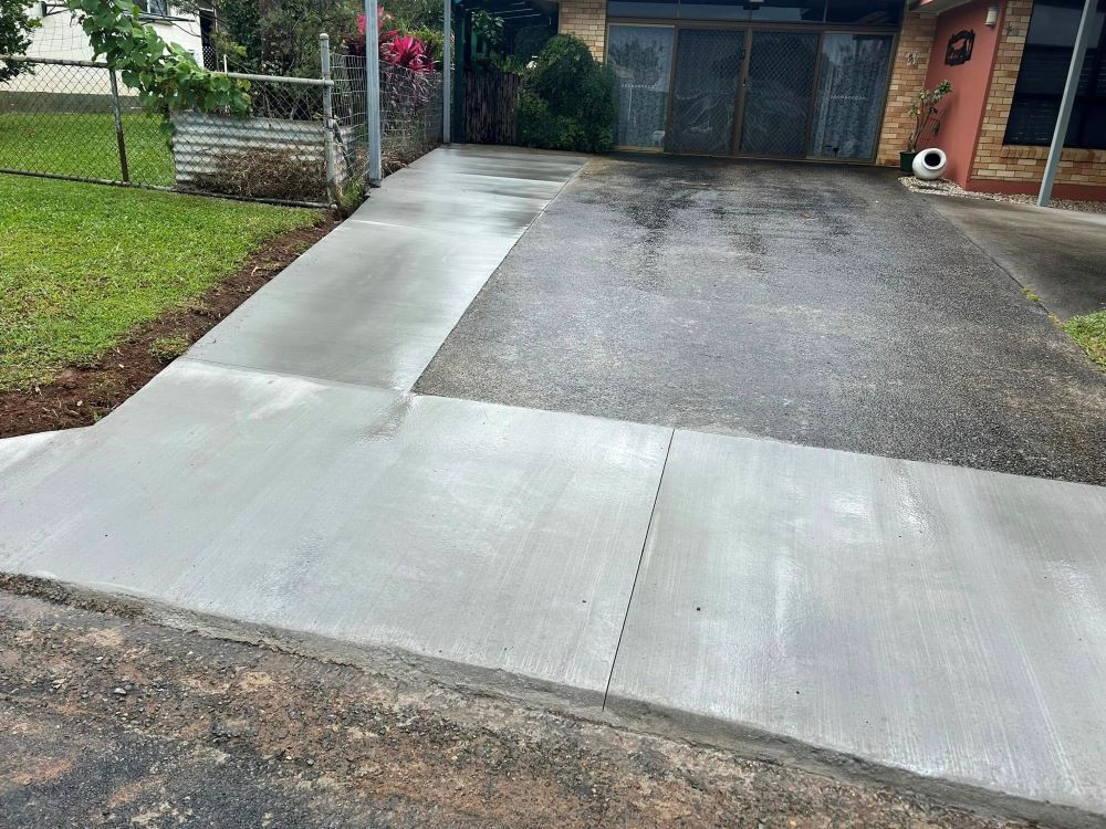 A Concrete Driveway is Being Built in Front of a House — Core Concrete in Port Douglas, QLD