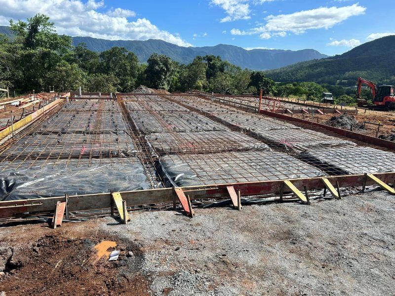 A Construction Site With a View of Mountains in the Background — Core Concrete in Port Douglas, QLD