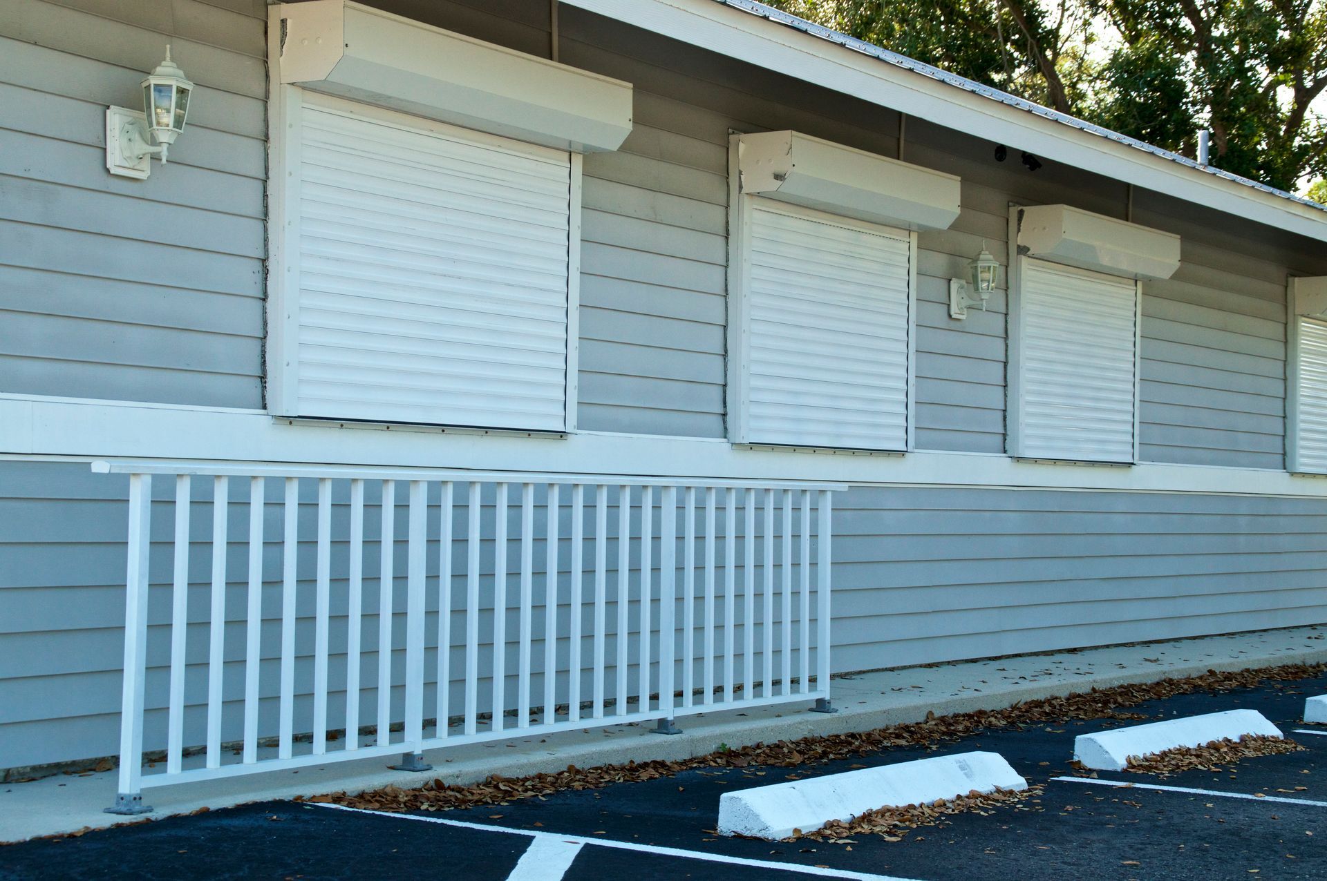 Building with hurricane resistant shutters installed to protect windows.