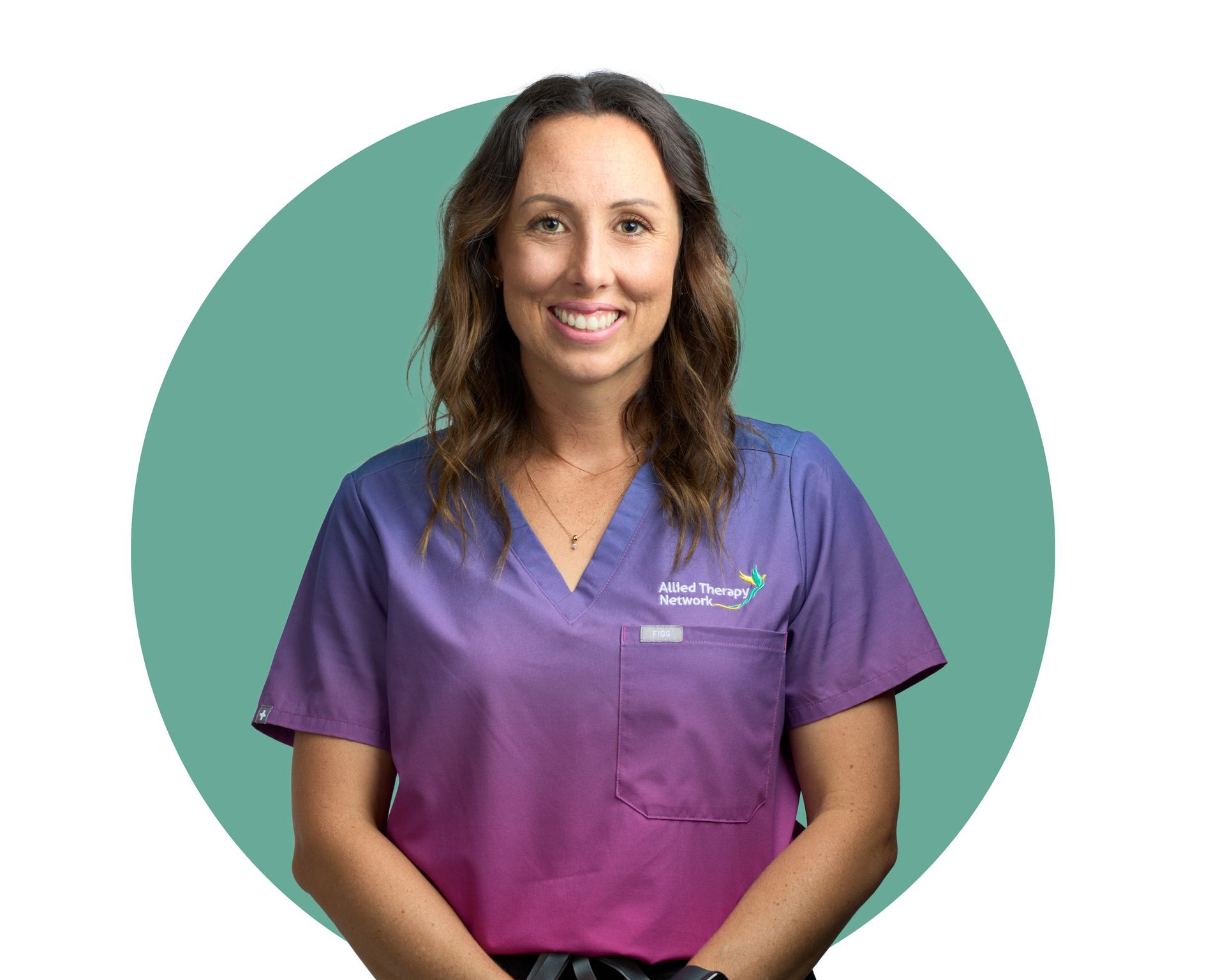 A woman in a purple scrub top is smiling in a green circle.