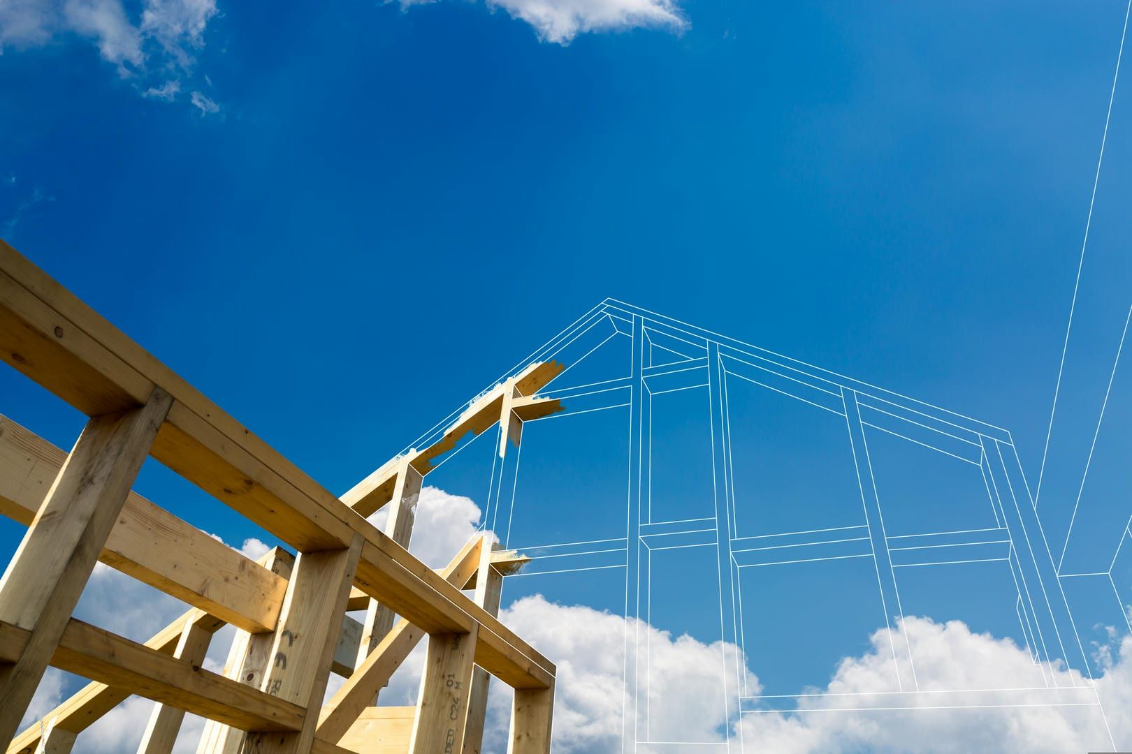A house is being built with a blue sky in the background.