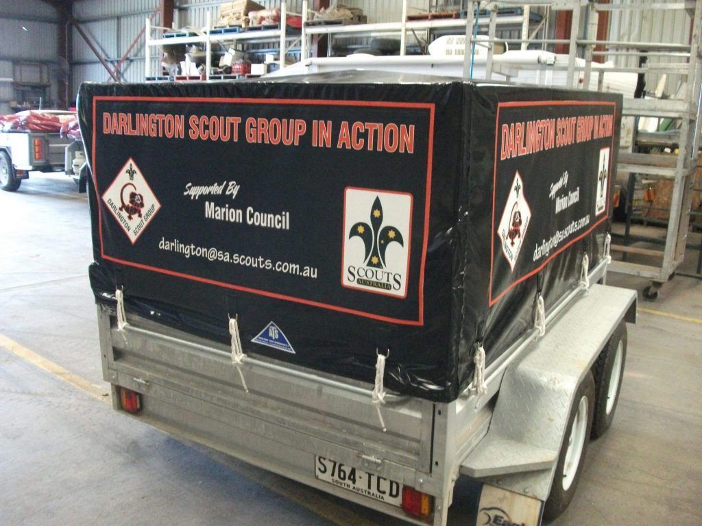 Trailer with black cover advertising Burlington Scout Group; supported by Merton Council.